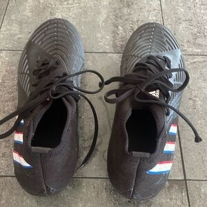 Men’s size US 9 new adidas soccer cleats. Never worn.